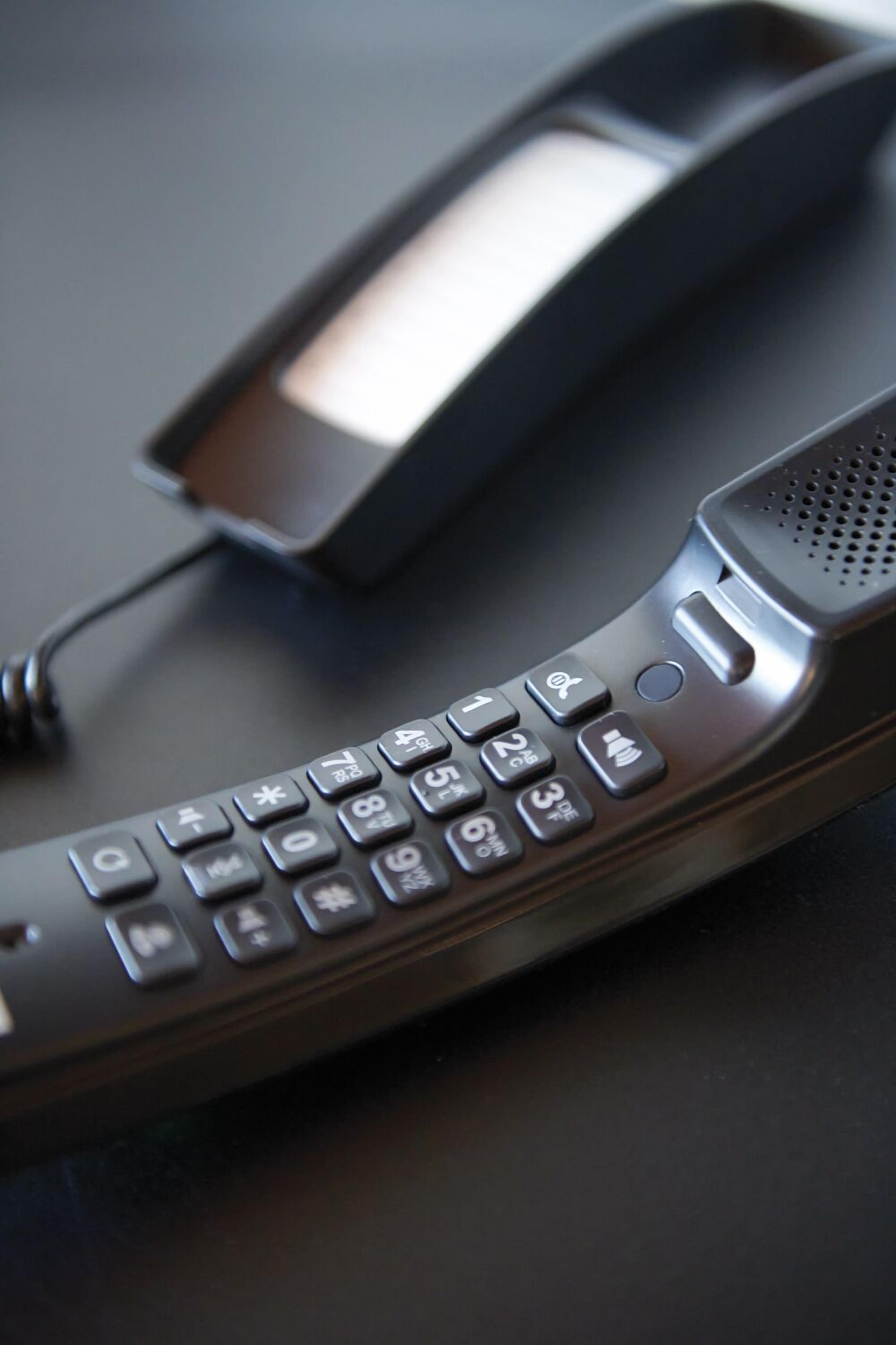 A cordless telephone with a numeric keypad and a speaker grille.