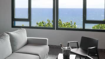 Junior Quadruple Room | Minibar, in-room safe, desk, laptop workspace