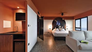 Junior Quadruple Room | Minibar, in-room safe, desk, laptop workspace