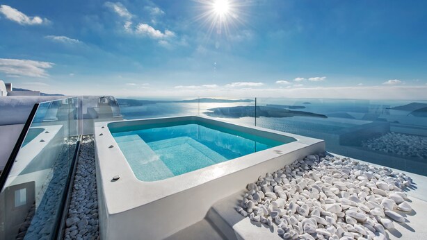 A modern infinity pool with a clear view of the sea and distant islands. - 2 Bed Villa - Sleeps 4 - Pool - Private Chef (Santorini)
