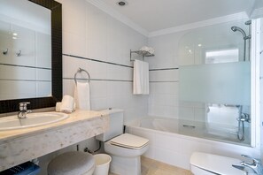 Bathtub, hair dryer, towels, soap
