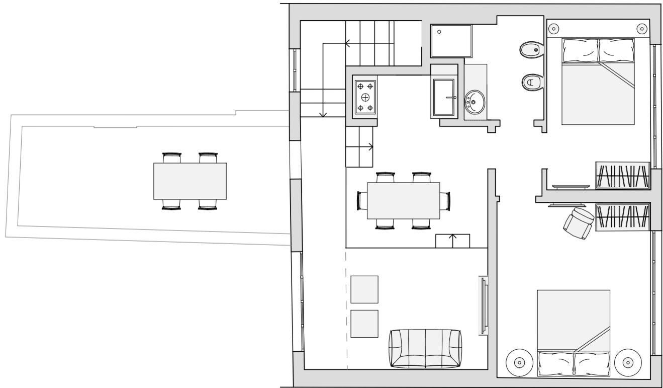 A floor plan with a dining area, kitchen, and a bedroom.