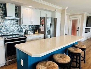 Fridge, microwave, oven, dishwasher - Experience stunning oceanfront views at Nauti Time, a spacious 5-bedroom retreat in Holden Beach. (Holden Beach)