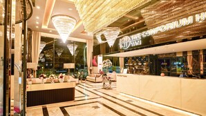 A luxurious hotel lobby with a reception desk, chandeliers, and a modern interior design. - The Conforium Hotel Van (Van)