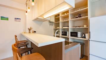 Mini-fridge, microwave, stovetop, cookware/dishes/utensils