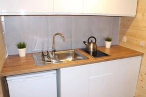 Fridge, microwave, stovetop, coffee/tea maker