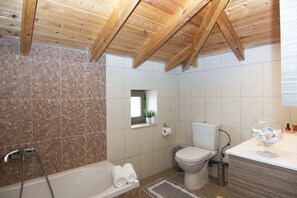 Bathtub, hair dryer, towels