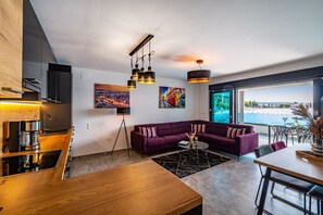 Luxury Apartment | Living area | 42-inch flat-screen TV with satellite channels, TV