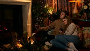 A cozy living room with a fireplace, a sofa, and a table with candles and flowers. - Oppulent Lansdown Crescent Mews House with Free parking - Pass the Keys (Bath)