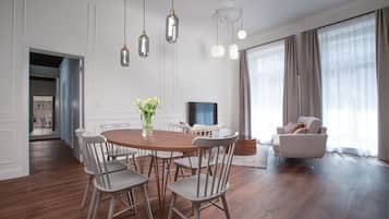 Executive Apartment | Living area | 60-cm flat-screen TV with cable channels, TV