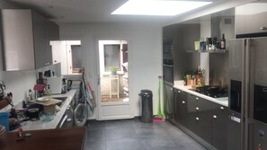 Microwave, dishwasher, coffee/tea maker, cookware/dishes/utensils