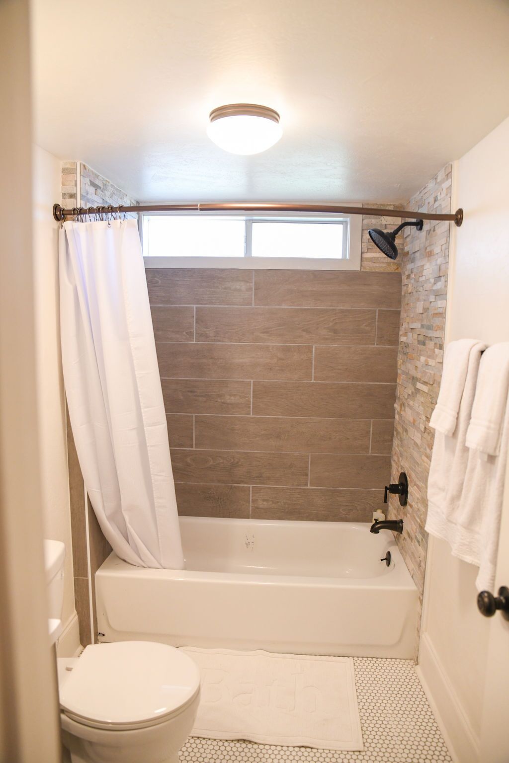 Bathtub, hair dryer, towels, shampoo