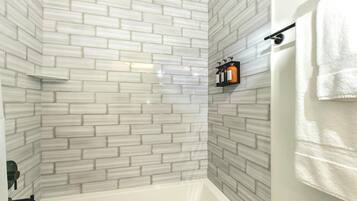 Combined shower/tub, hair dryer, towels, soap
