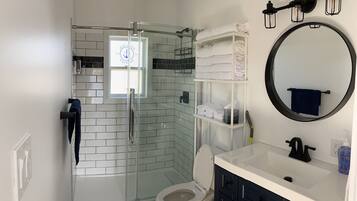 Shower, hair dryer, towels, soap