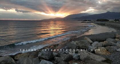 250 metres from the sea a tiny independent house with a yard full of flowers!