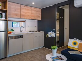 Deluxe Mobile Home | Private kitchen | Fridge, stovetop, highchair, cookware/dishes/utensils