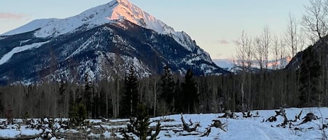 A snowy mountain landscape with a clear sky.