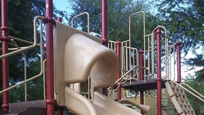 A playground with a slide and climbing structures. - VILLA Verde Surprise Stadium - Resort Living (Surprise)