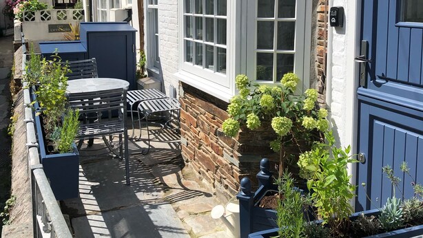 A traditional stone building with a blue door labeled "FISHER COTTAGE." - Fisherman's Cottage, a haven in Padstow old town (Padstow)