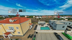 A residential area with multiple apartment buildings, each marked with arrows indicating their location. - Room in Zaton (Zadar) with WIFI, Washing machine (4141-9) (Nin)