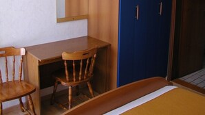 A bedroom with a wooden desk, two chairs, a bed, a wardrobe, and a mirror. - Room in Vodice with Terrace, Air condition, WIFI (4826-2) (Vodice)
