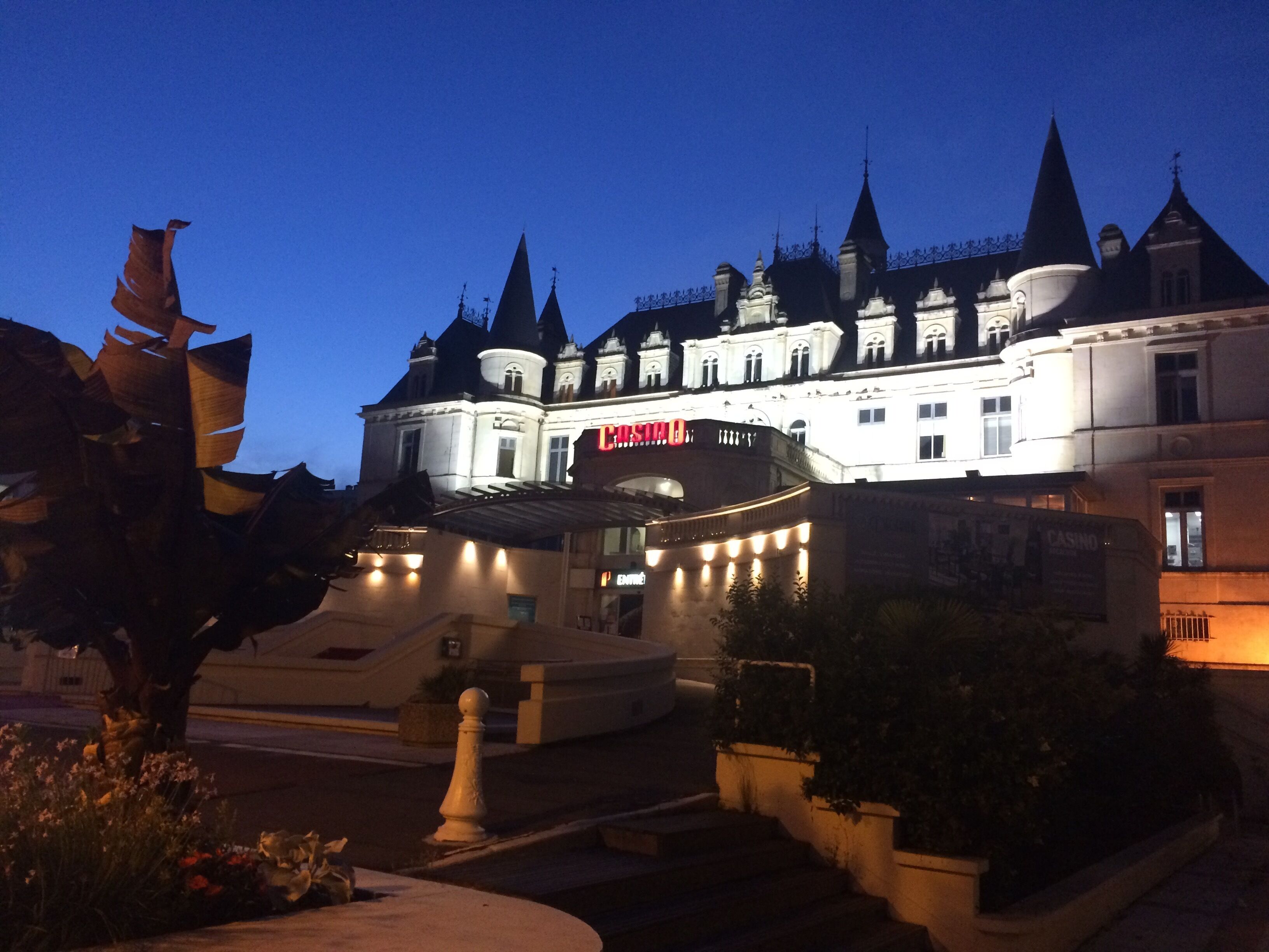 A large, historic building with multiple spires and a prominent entrance labeled "CASINO".