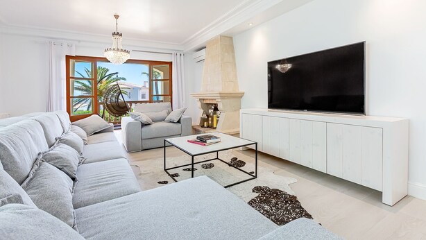 A modern living room with a sofa set, a coffee table, a TV, and a fireplace. - Luxury Villa with Seaview and private Beach access (Muro)