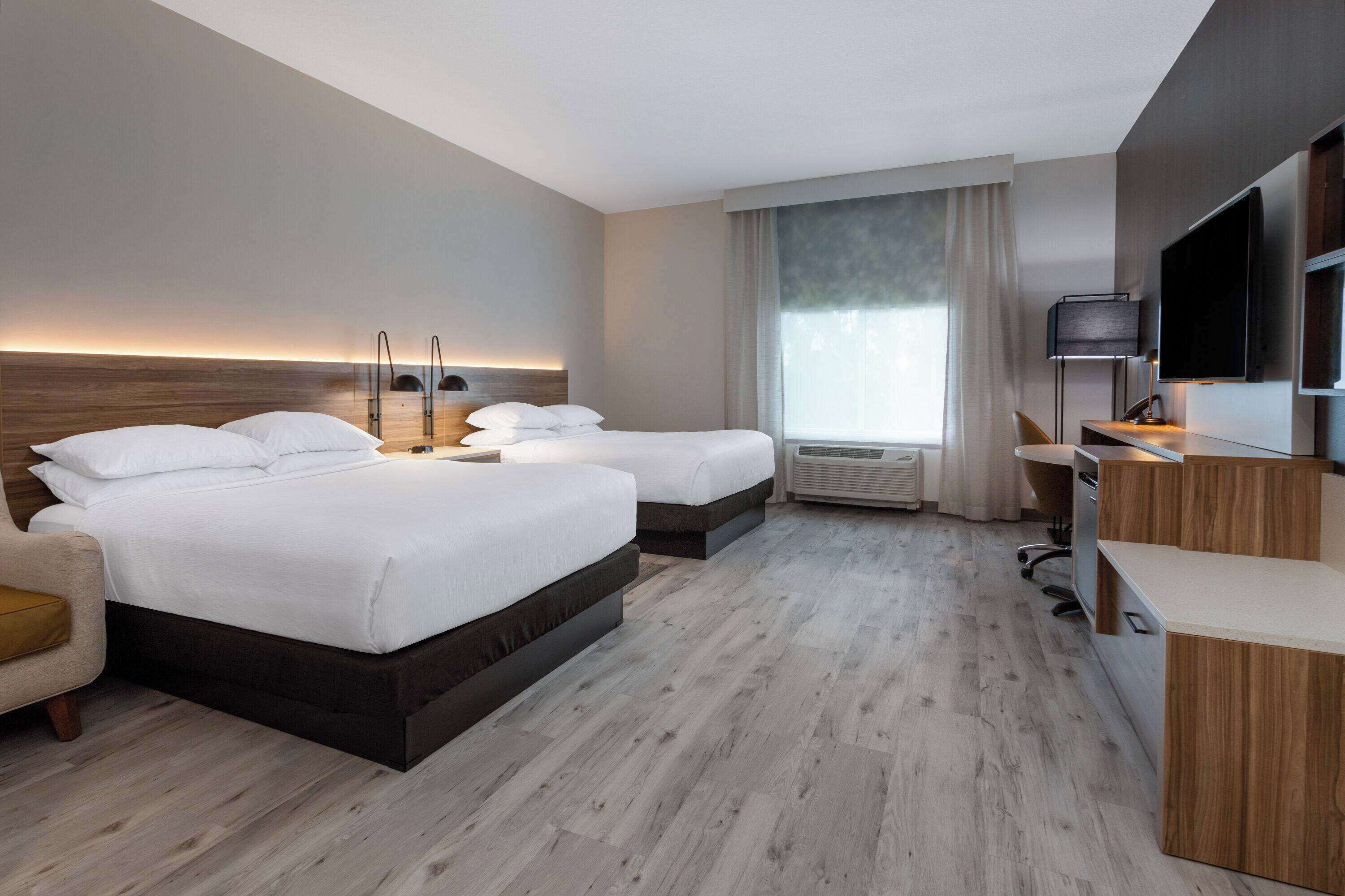 deluxe room, 2 queen beds, non smoking | desk, laptop workspace, iron/ironing board, free wifi