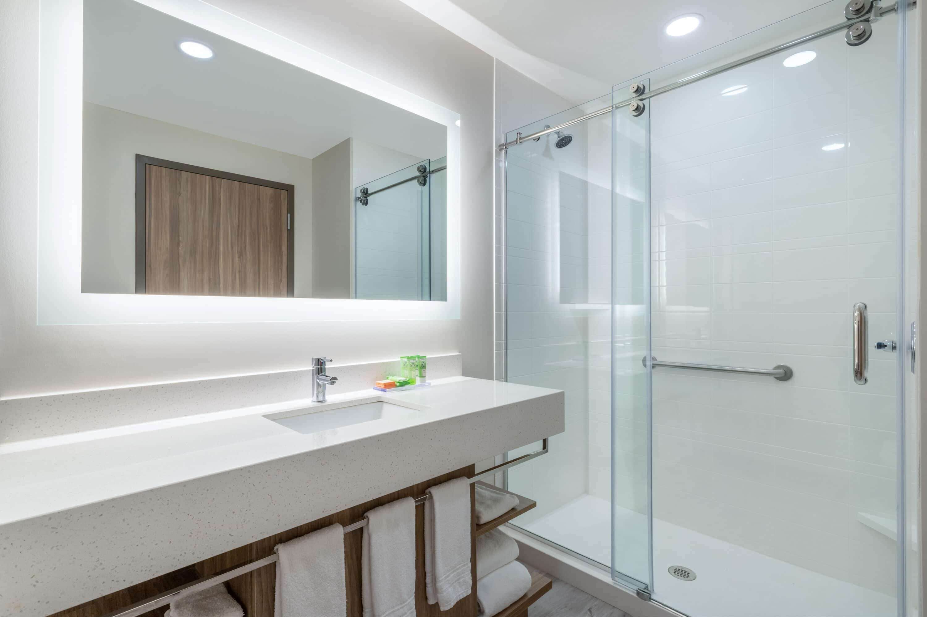 designer toiletries, hair dryer, towels, soap