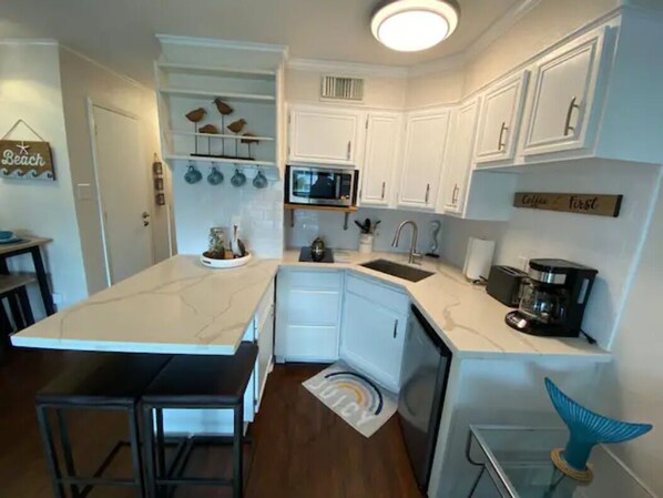 Fridge, microwave, stovetop, coffee/tea maker