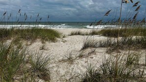 A beach with sand dunes and grass. - 3 bed/2 bath private oceanfront home with direct beach access on Amelia Island! (fernandina beach)