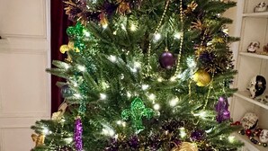 A Christmas tree with lights and ornaments.