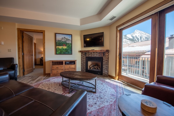 Condo, 2 Bedrooms | Living area | TV, fireplace
