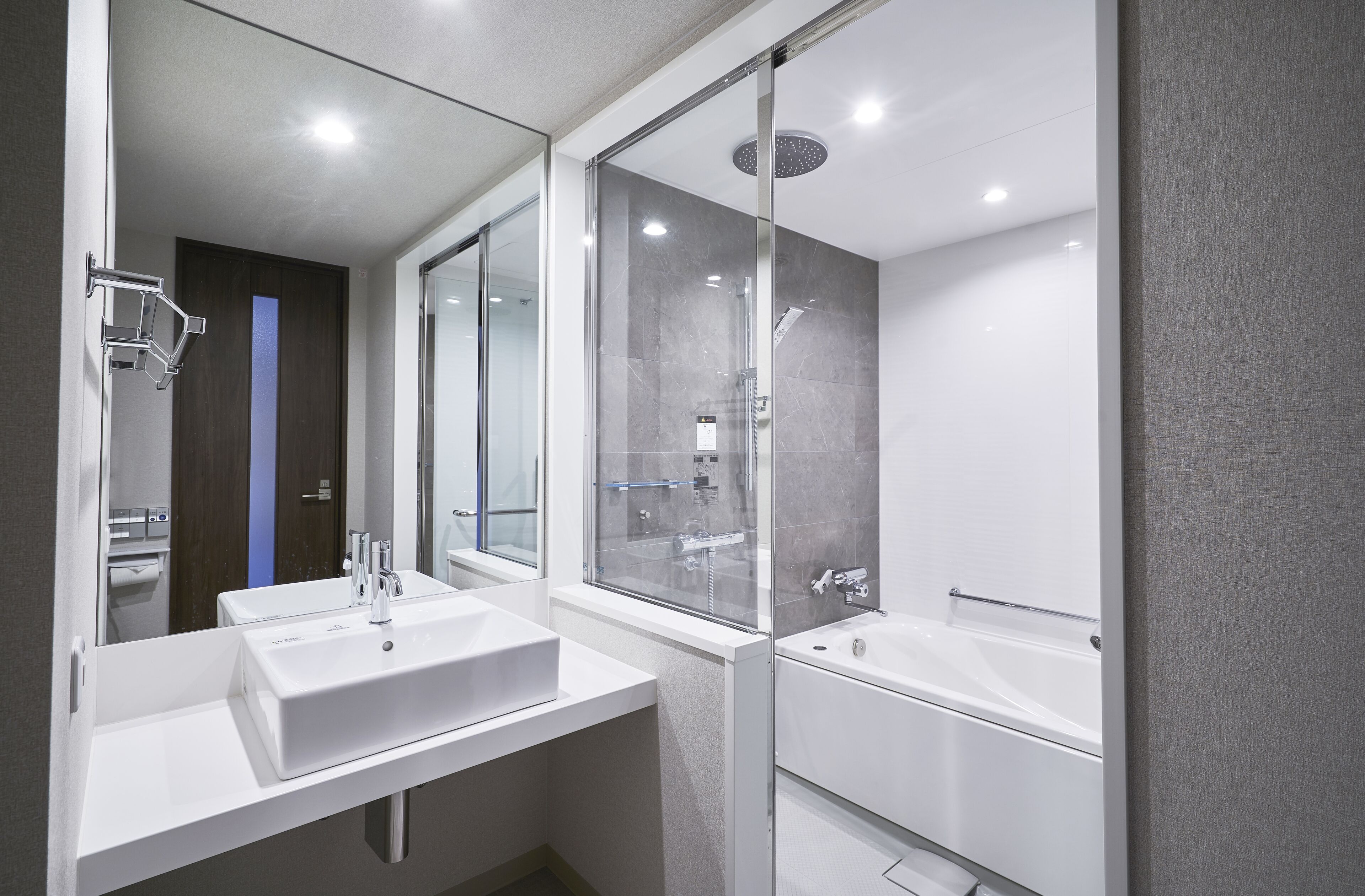 separate bathtub and shower, deep-soaking bathtub, rainfall showerhead