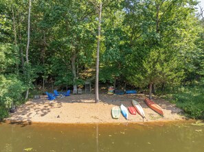 A lakeside campsite with kayaks and a fire pit. - Peace of Lake Aspen Pt. II by Innsbrook Vacations! (Innsbrook)