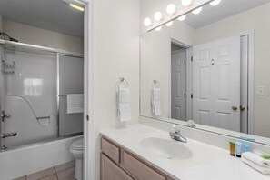 Combined shower/tub, towels, soap, shampoo