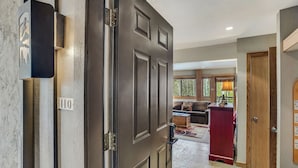 A hallway with a closed door, a mailbox, and a red cabinet. - 🏔️Ski Access~Hot Tub~Studio Premier 110🏔️ (Snowmass Village)