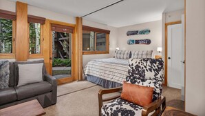 A bedroom with a bed, a sofa, a chair, and a window. - 🏔️Ski Access~Hot Tub~Studio Premier 201🏔️ (Snowmass Village)