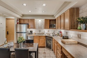 Full kitchen with dining table