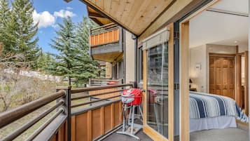 1 bedroom, desk, iron/ironing board, travel crib