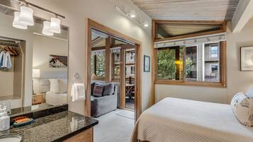 1 bedroom, desk, iron/ironing board, travel crib