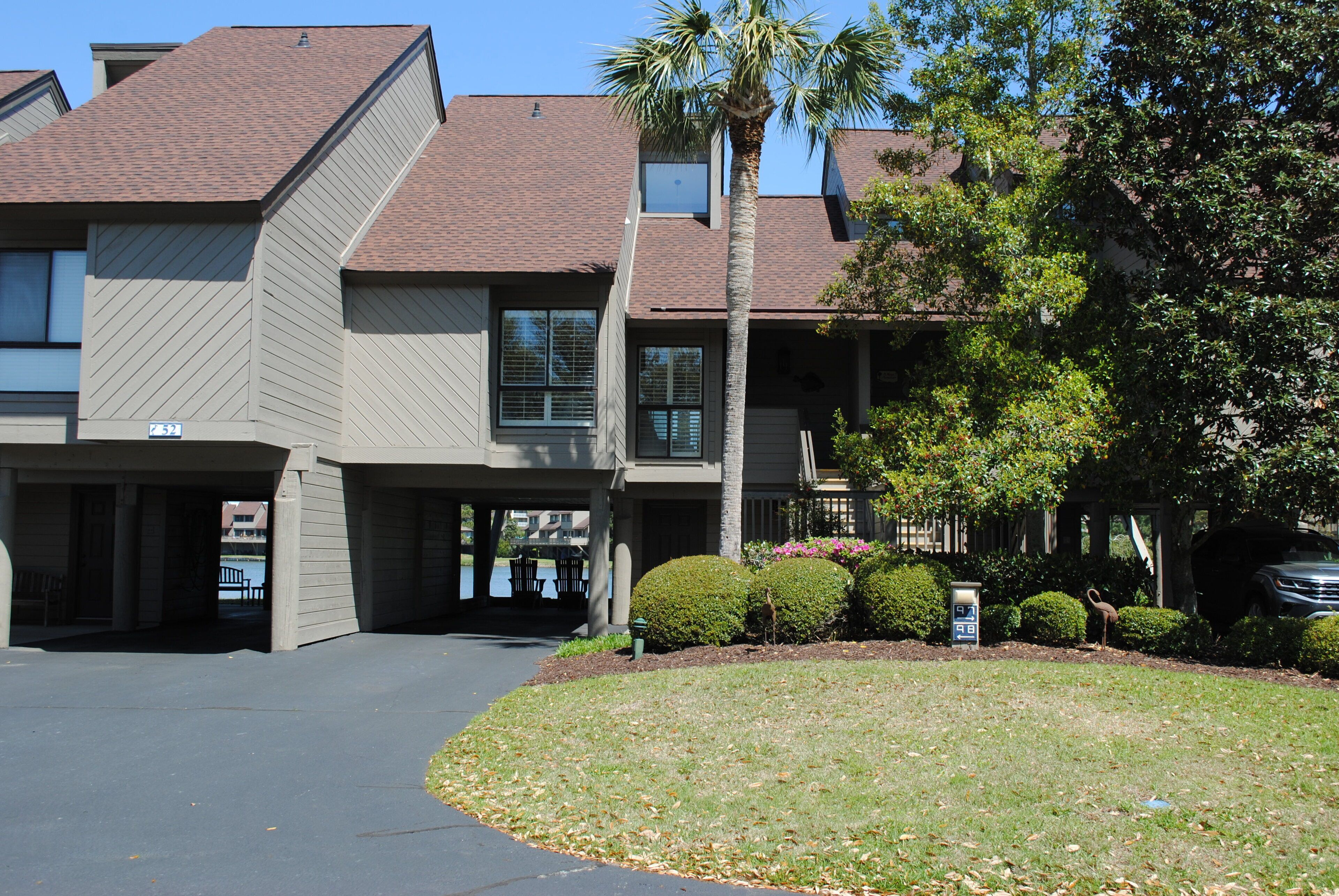 Villa with lake views and pool access located within gated Litchfield By the Sea community.
