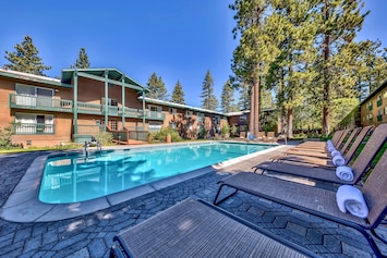 Large swimming pool and poolside loungers