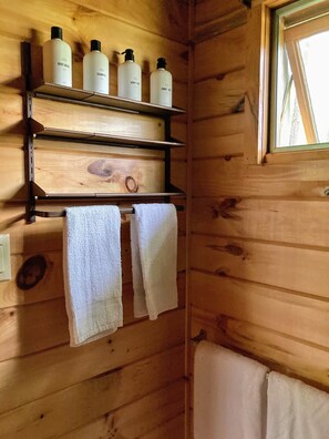 Shower, hair dryer, towels, soap
