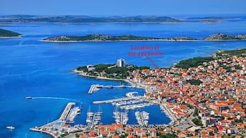 Located near the bustling marina, this apartment offers stunning views of the coastal town.