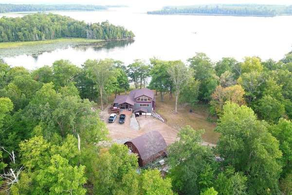 Cabin is angled to view 3 Bays into Woman Lake. 3 Sides are DNR land. Private.