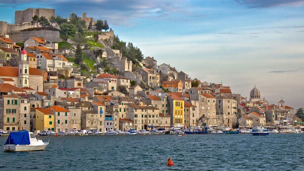 A coastal town with historic buildings, a prominent church, and a castle on a hill. - A3 - Best Location in Center With the sea View (Vodice)