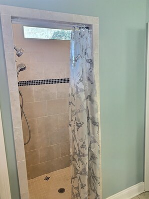 Combined shower/tub, hair dryer, towels, soap