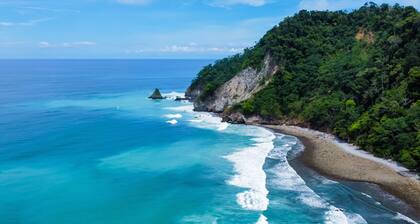 Spectacular beachfront & tropical home with a shared pool, W/D, lanai, hammock