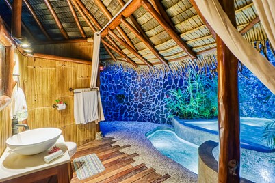 Spectacular beachfront & tropical home with a shared pool, W/D, lanai, hammock